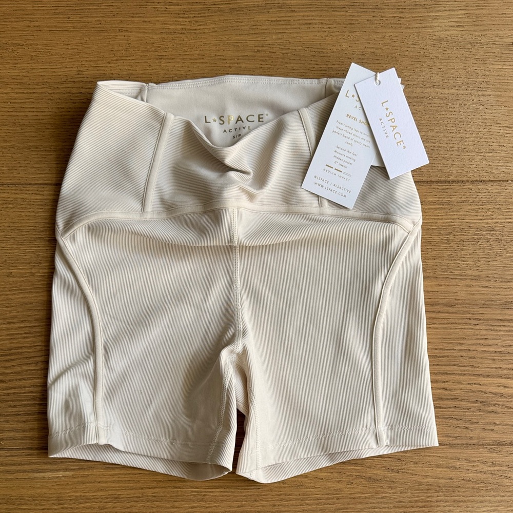 L*SPACE Cream Revel Ribbed High-Waist Bike Shorts in color bone